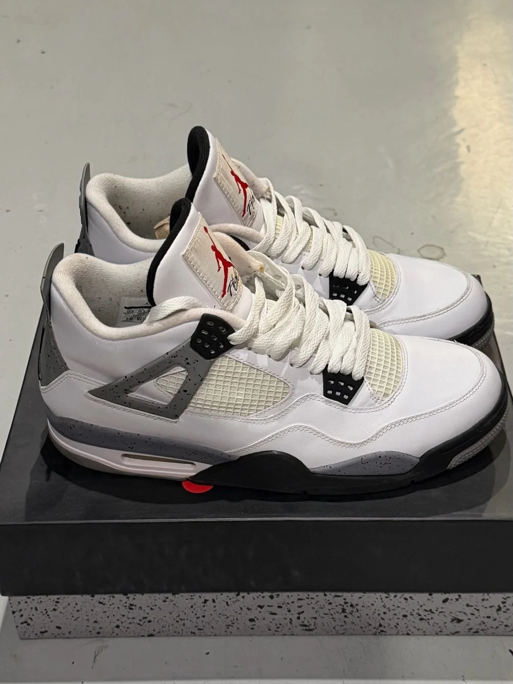 Jordan Men’s White/ Cement Gray/Black Retro 4 Sneakers with Red Jumpman